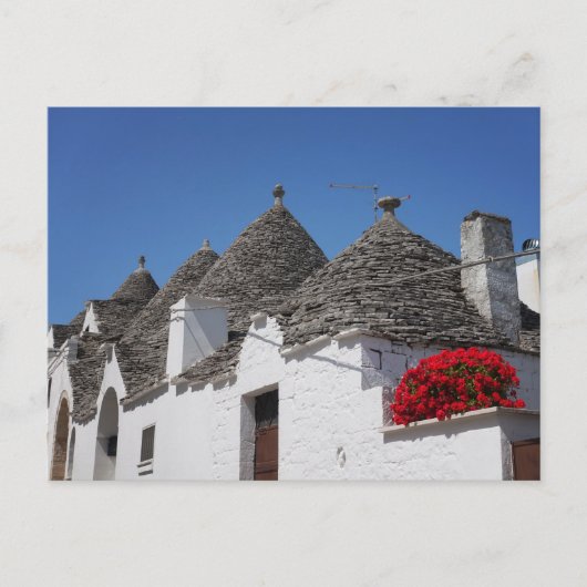 Geranium-Blume und Trulli-Häuser in Alberobello Postkarte (Vorderseite)