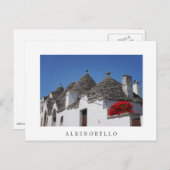Geranium Blume und Trulli Häuser in Alberobello Postkarte (Vorne/Hinten)