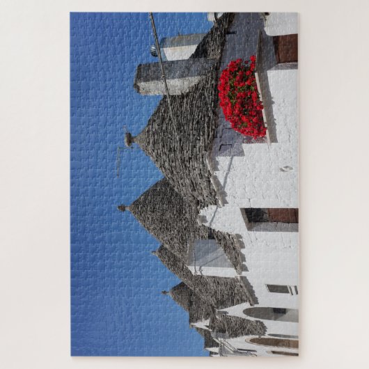 Geranium Blume und Trulli Häuser in Alberobello Puzzle (Vertikal)