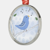 Gesang-niedliche Drossel auf einer Silbernes Ornament (Links)