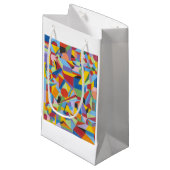 Geschenktüte mit viel Spaß in hellen Farben und fe (Vorderseite Schrägansicht)