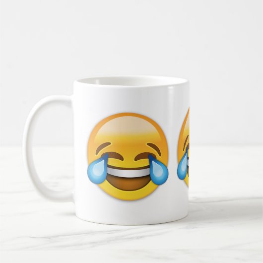 Gesicht mit Rissen der Freude Emoji Kaffeetasse (Links)