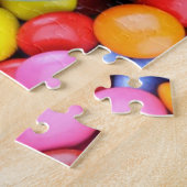 Gestreifter Lutscher und mehrfarbige Smarties Puzzle (Seite)