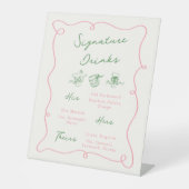 Getränke mit weißer Hand, rosa und grüne Unterschr Sockelschild (Vorderseite)