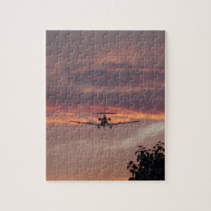 Gewerblicher Jet landet bei Sonnenuntergang Puzzle