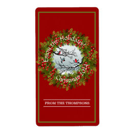 Gewohnte Vögel in schneebedeckten Nadeln Red Berri