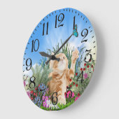 Ginger kitten playing with a butterfly große wanduhr (Winkel)