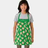 Gingerbread Man Cookies auf dem Muster des grünen Schürze (Insitu)