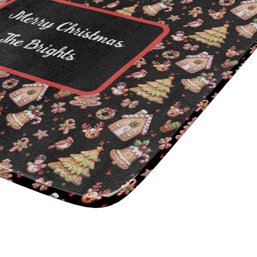 Gingerbrot Weihnachtskochtchen auf schwarzem Hinte Schneidebrett (Ecke)