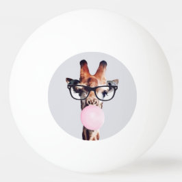 Giraffe wearing glasses blowing a pink bubble gum tischtennisball