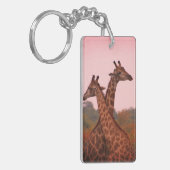 Giraffen, stehend in Mopanobäumen mit rosa Himmel Schlüsselanhänger (Vorderseite links)
