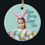 Girl Photo Bunny Ears Cute Blue  Keramik Ornament<br><div class="desc">Girl Photo with funny Easter Bunny Ears and painted eggs on blue background on your own Easter ceramic ornament. May be a keepsake for yourself, or a personalized gift for a friend or family member. Generative content images may be changed. Humor Greeting saying "Some Bunny Loves You" on the front...</div>