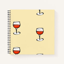 Glas Wein auf Orange Notizblock