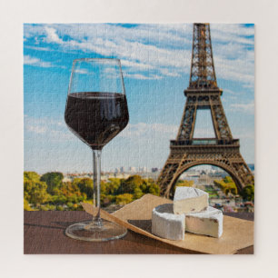 Glas Wein mit Brikenkäse auf dem Eiffelturm Puzzle