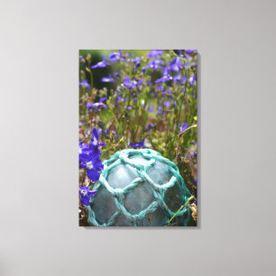 Glasfischerboje und Blumen Leinwanddruck