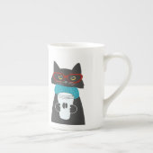 Glaskatze mit einer Tasse Kaffee (Rechts)