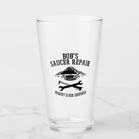 Glasklammer mit dem Saucer-Repair-Logo des schwarz Glas (Vorderseite)