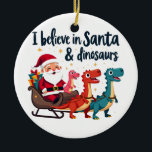 Glauben Sie an den Weihnachtsmann und Dinosaurier  Keramik Ornament<br><div class="desc">Weihnachten Spaß,  Weihnachtsmann und Dinosaurier,  Feiertagsspass,  festliche Dinosaurier,  Weihnachten 2024,  Weihnachten,  Dinosaurier Weihnachten,  Weihnachten,  Weihnachtsmann,  Weihnachtsmagie,  Dinosaurier-Liebhaber,  festliches Design,  Feiertagsjubiläum</div>