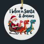 Glauben Sie an den Weihnachtsmann und Dinosaurier  Keramik Ornament<br><div class="desc">Weihnachten Spaß,  Weihnachtsmann und Dinosaurier,  Feiertagsspass,  festliche Dinosaurier,  Weihnachten 2024,  Weihnachten,  Dinosaurier Weihnachten,  Weihnachten,  Weihnachtsmann,  Weihnachtsmagie,  Dinosaurier-Liebhaber,  festliches Design,  Feiertagsjubiläum</div>
