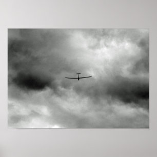 Glider flying in grey sky poster