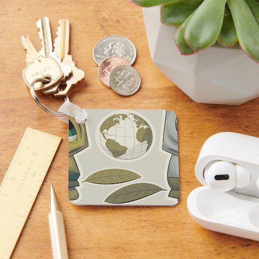 Globale Kreaturen auf der Erde stehen vor dem Schl Schlüsselanhänger