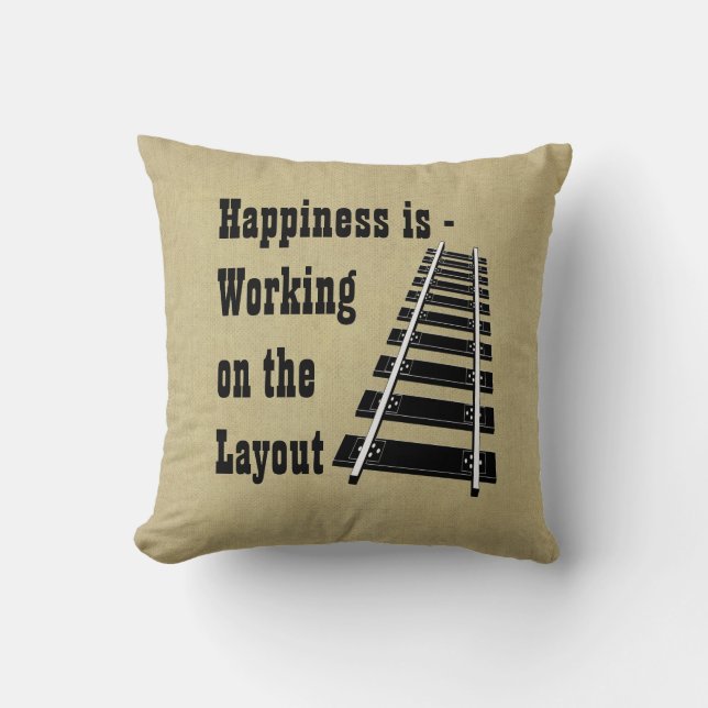 Glück arbeitet an der Modellbahn des Layouts Kissen (Vorderseite)