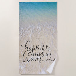 Glück kommt in Wellen-Spaß-Schriftart mit Strandtuch