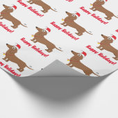Glückliche Feiertage mit Dackel-tragender Geschenkpapier (Ecke)
