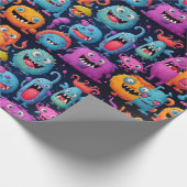 Glückliche Gruppe farbenfroher Monster auf schwarz Geschenkpapier (Ecke)