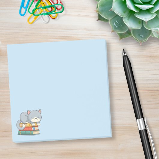 Glückliche Katze auf einem Buchstapel Blau Post-it Klebezettel