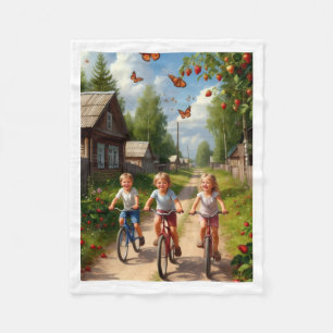 Glückliche Kinder beim Fahrradfahren auf dem Land Fleecedecke