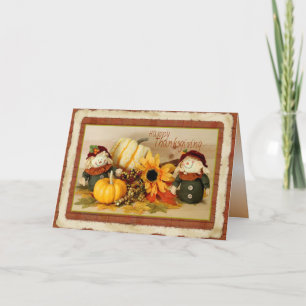 Glückliche Thanksgiving-Karte mit Scarecrows Feiertagskarte