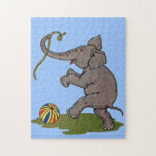 glücklicher Elefant, der mit Seil und Ball spielt Puzzle