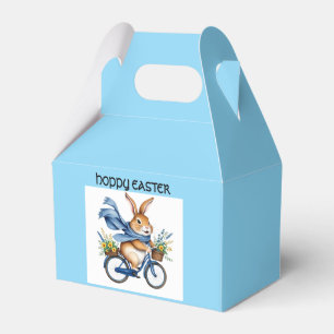 glücklicher Osterhase auf Fahrrad blau Geschenkschachtel