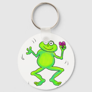 Glücklicher wunderlicher Frosch, der in der Hand Schlüsselanhänger