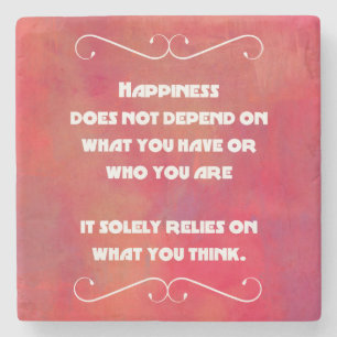 Glücksquote auf einem orangefarbenen Abstrakte Steinuntersetzer