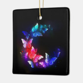 Glühende Neon-Nachtschmetterlinge auf schwarzem Hi Keramikornament (Links)