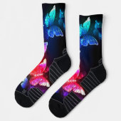 Glühende Neon-Nachtschmetterlinge auf schwarzem Hi Socken (Links)
