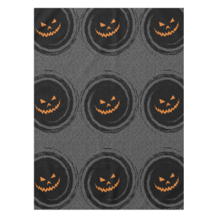 Glühender Jack O'Lantern Halloweens in einem Tischdecke