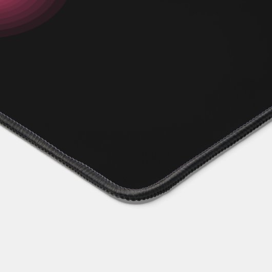 Glühender rosa Effekt auf schwarz Schreibtischunterlage (Ecke)