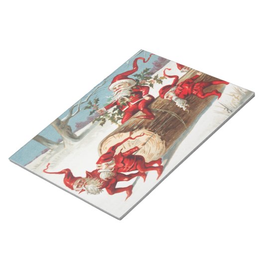 Gnomes dragging a cut tree trunk through the snow notizblock (angewinkelt)