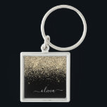 Gold Black Glitzer Script Monogram Girlaname Schlüsselanhänger<br><div class="desc">Monogram Name Keychains (Key Chain): Gold und Black Sparkle Glitzer Script. Das macht den perfekten 16 Geburtstag,  Hochzeit,  Brautparty,  Jubiläum,  Babydusche oder Junggeselinnen-Abschied Geschenk für jemanden,  der Lieben glamourösen Luxus und schicke Stile.</div>