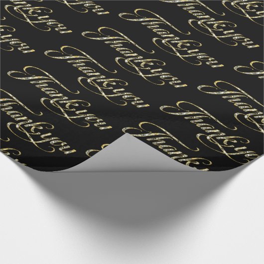 Gold Glitzer dankt dem Text auf schwarz Geschenkpapier (Ecke)