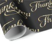 Gold Glitzer dankt dem Text auf schwarz Geschenkpapier (Rolleneckpunkt)
