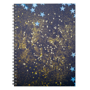 Gold Glitzer und glitzernde blaue Sterne auf schwa Notizblock