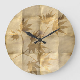 Gold maple leaves on parchment paper elegant große wanduhr