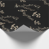 Gold-Musiknoten auf schwarzem Medium Geschenkpapier (Ecke)