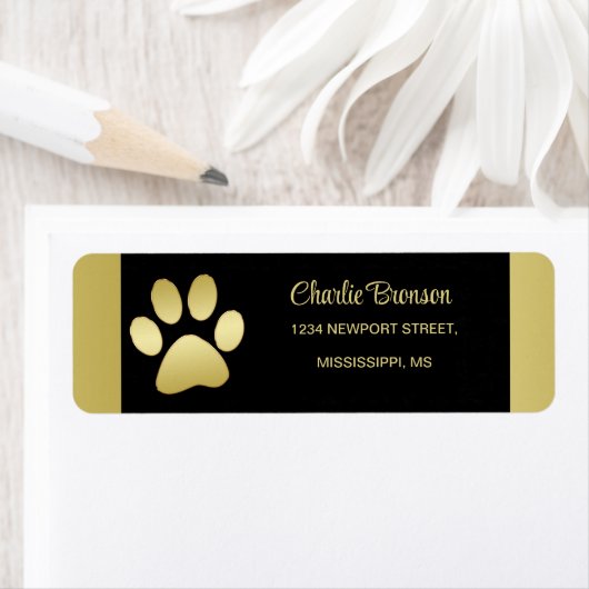 Gold Shiny Dog Paw auf schwarzem Hintergrund (Insitu)