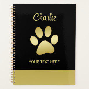Gold Shiny Dog Paw auf schwarzem Hintergrund Planer