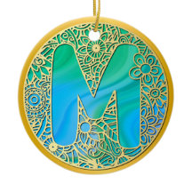 Gold, Türkisbuchstaben M und farbenfrohe Blume